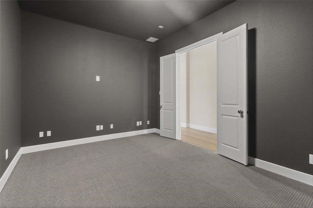 unfurnished bedroom with carpet floors