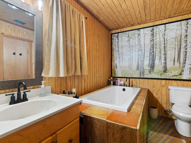 bathroom featuring vanity, a bath, wooden walls, toilet, and wood ceiling