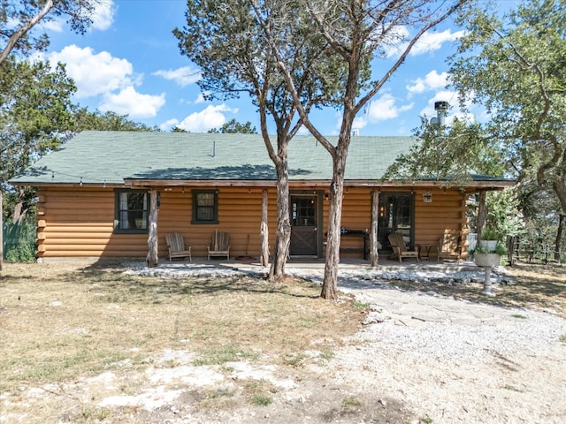 rear view of property featuring a patio area and outdoor lounge area