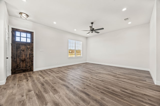 living room featuring hardwood / wood-style flooring and ceiling fan