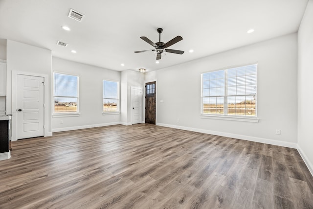 living room with light hardwood / wood-style floors and ceiling fan