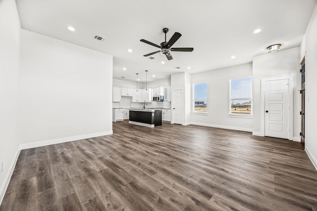 entrance foyer featuring wood-type flooring and a healthy amount of sunlight