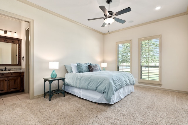 bedroom with sink, ensuite bath, ceiling fan, ornamental molding, and light colored carpet