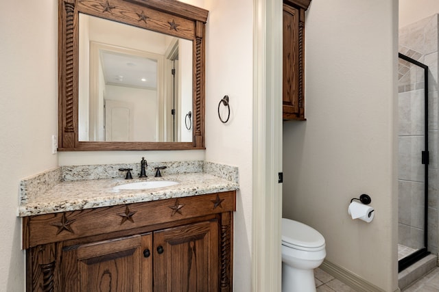 bathroom with an enclosed shower, vanity, toilet, and tile patterned flooring