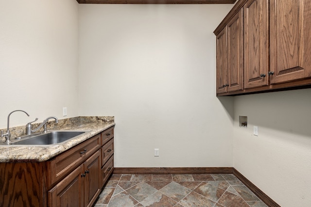 washroom with sink, cabinets, and washer hookup