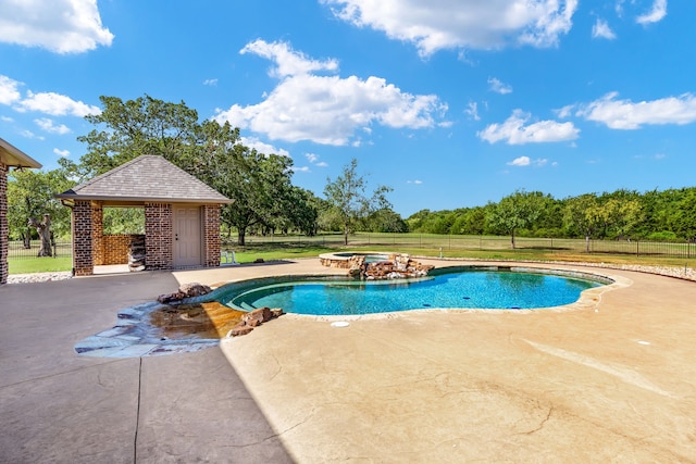 view of swimming pool featuring an in ground hot tub, a gazebo, and a patio