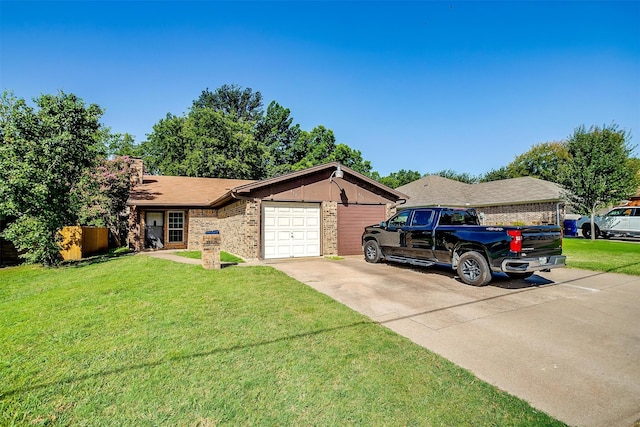 ranch-style house featuring a front yard and a garage