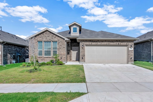 view of front of property with a garage and a front lawn