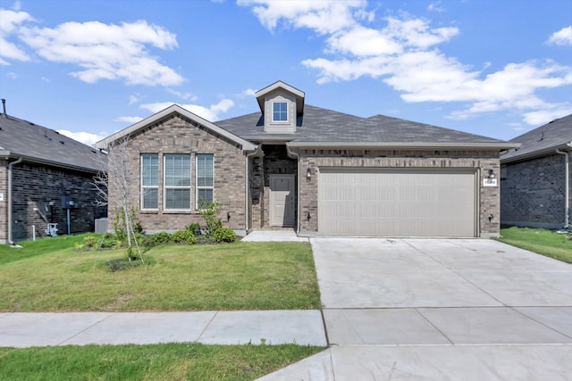 view of front of home featuring a garage and a front yard