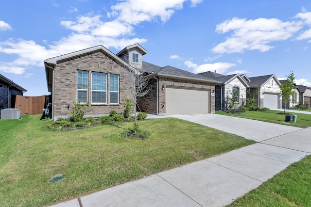 view of front of home featuring a garage, central AC unit, and a front lawn