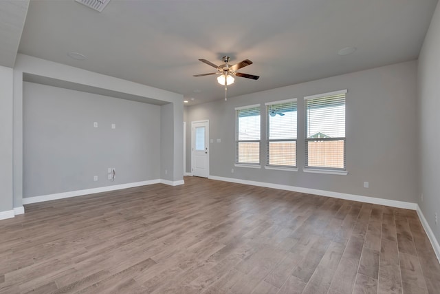 spare room featuring ceiling fan and hardwood / wood-style floors