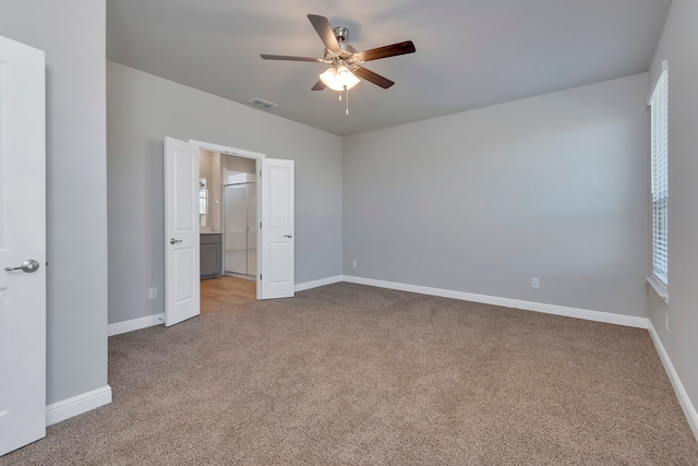 unfurnished bedroom with ceiling fan and carpet flooring