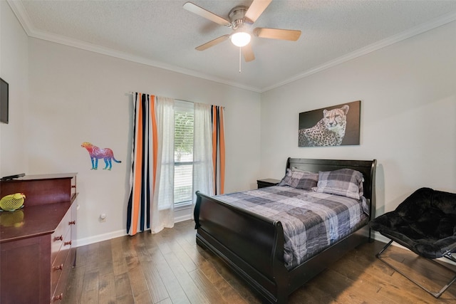 bedroom featuring a textured ceiling, ornamental molding, dark hardwood / wood-style floors, and ceiling fan