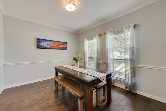 dining area featuring ornamental molding, dark hardwood / wood-style flooring, and a textured ceiling