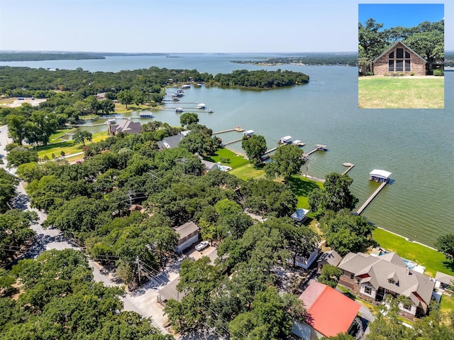 birds eye view of property with a water view