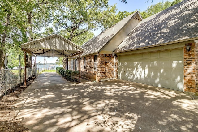 view of side of property with a garage