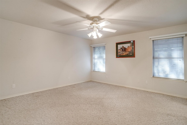 unfurnished room featuring carpet floors and ceiling fan