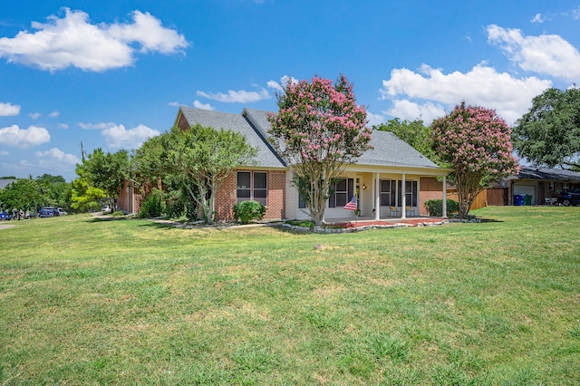 view of front of home with a porch and a front lawn