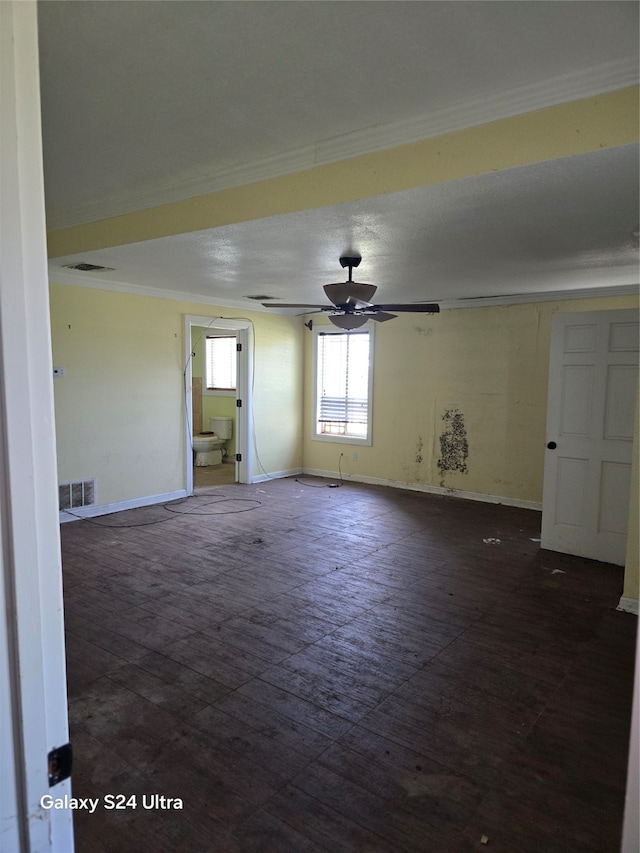 unfurnished room with ornamental molding and ceiling fan