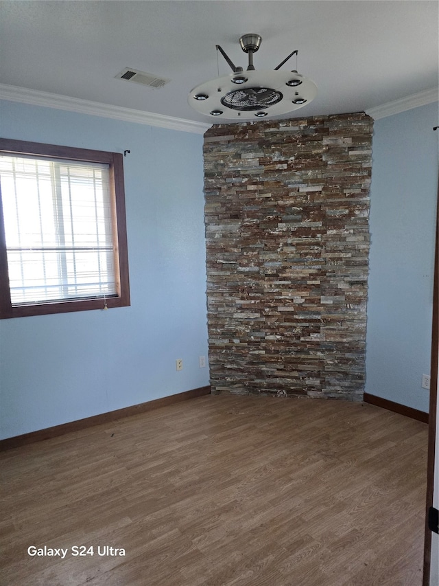 unfurnished room with dark hardwood / wood-style flooring and crown molding