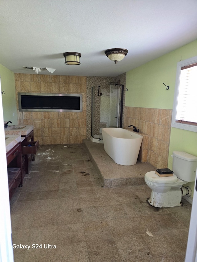 bathroom featuring walk in shower, a textured ceiling, toilet, tile patterned floors, and vanity