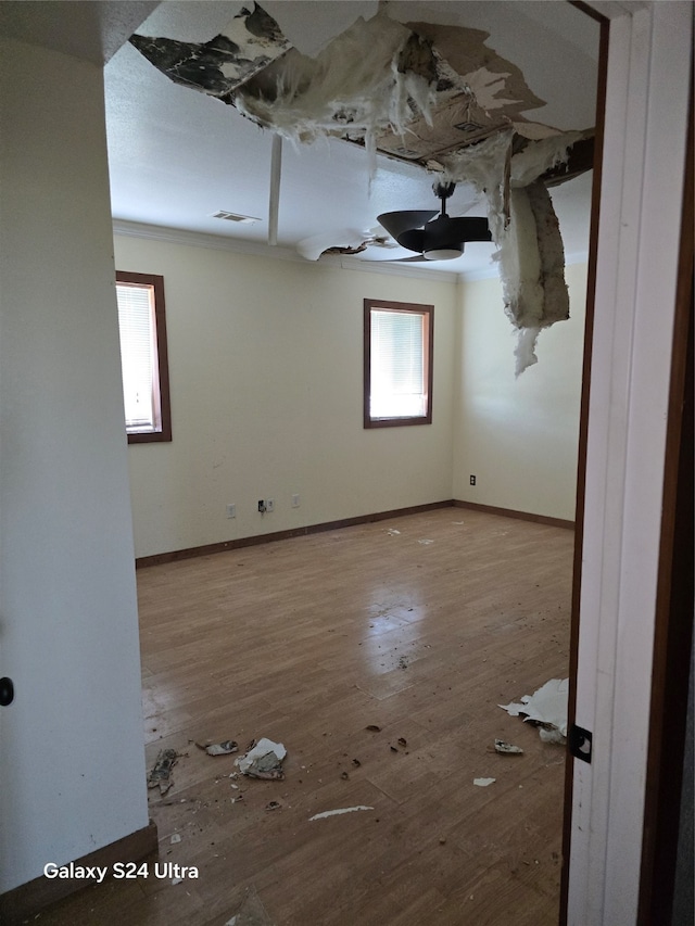 unfurnished room with wood-type flooring