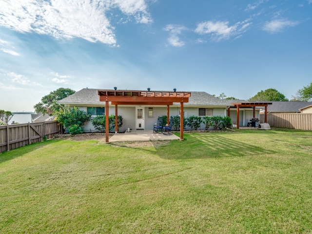 back of property with a pergola, a patio, and a yard