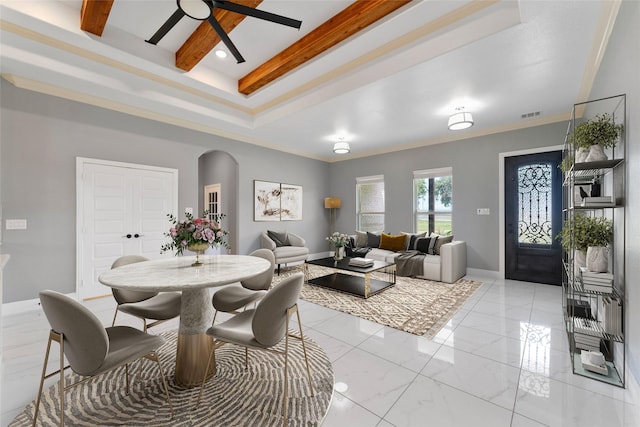 dining space featuring ceiling fan and ornamental molding