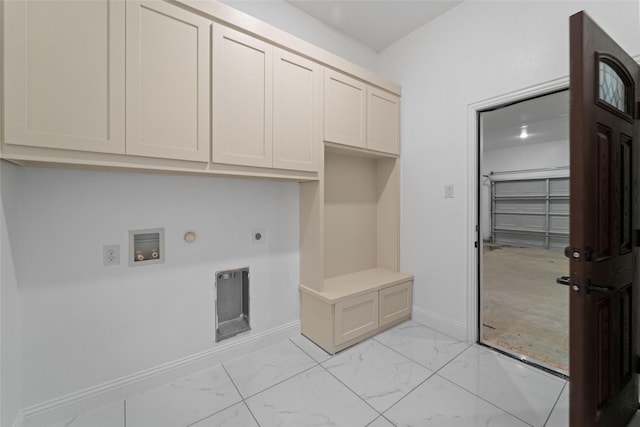 laundry room featuring electric dryer hookup, cabinets, gas dryer hookup, and hookup for a washing machine