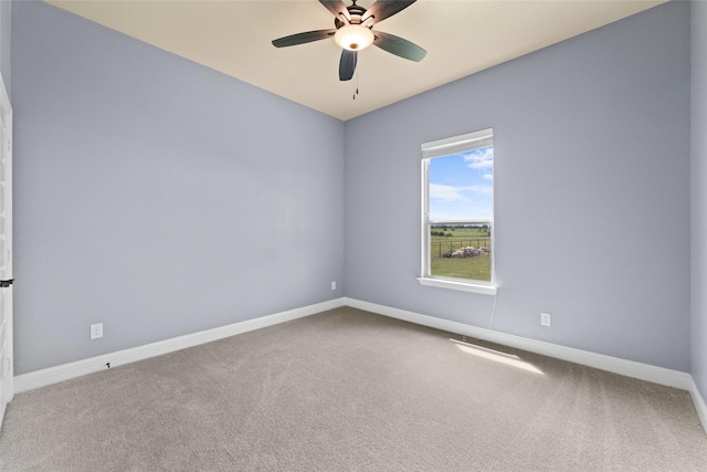 empty room with carpet flooring and ceiling fan