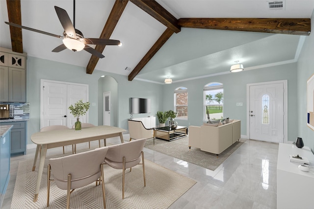 interior space featuring ceiling fan, beamed ceiling, and high vaulted ceiling