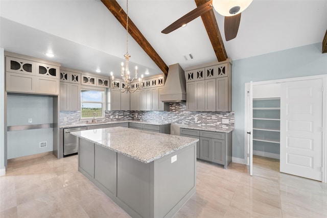 kitchen with dishwasher, premium range hood, sink, beamed ceiling, and a kitchen island