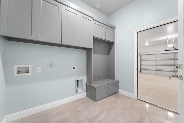 laundry area featuring cabinets, washer hookup, gas dryer hookup, and electric dryer hookup