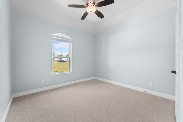 empty room featuring carpet and ceiling fan