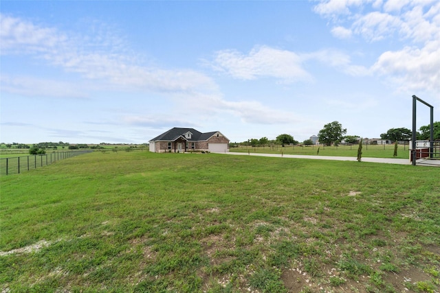 view of yard with a rural view