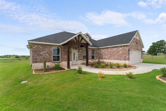 view of front facade with a garage and a front yard