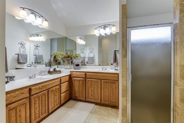 bathroom with tile patterned flooring, vanity, lofted ceiling, and walk in shower