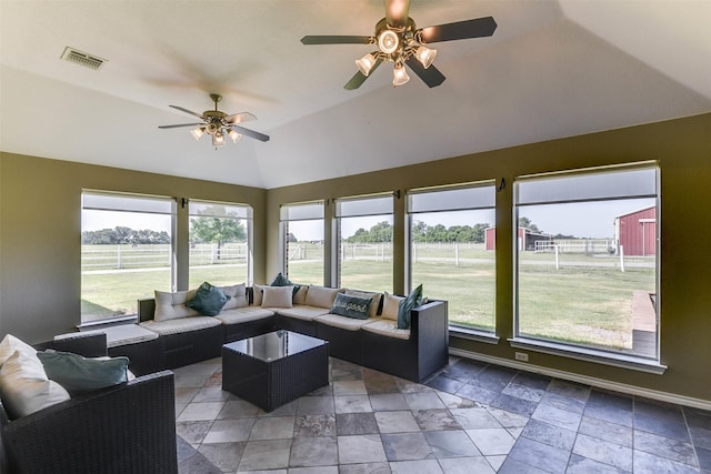 interior space with ceiling fan and lofted ceiling