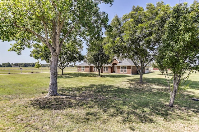 view of yard with a rural view