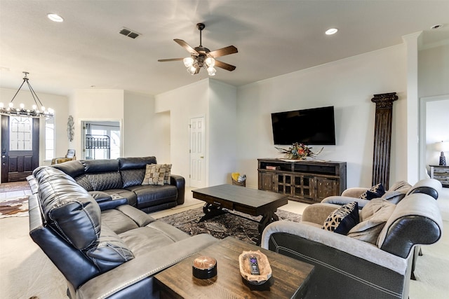 living room featuring carpet flooring and ceiling fan with notable chandelier