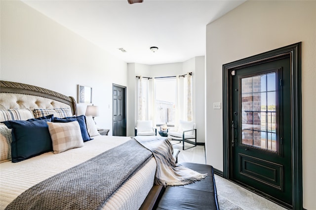 bedroom with light colored carpet