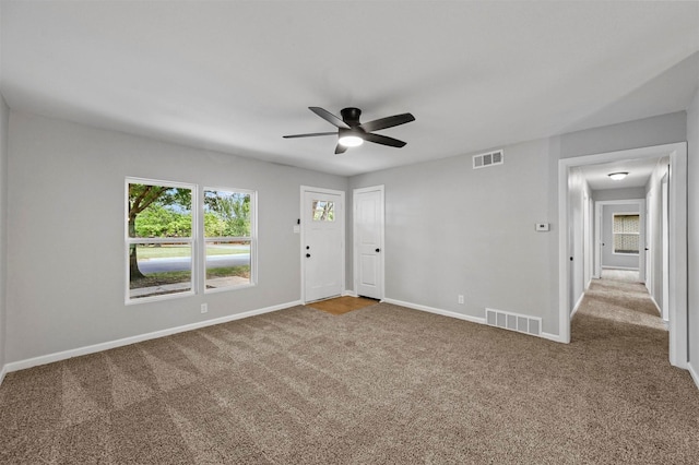 carpeted empty room with ceiling fan