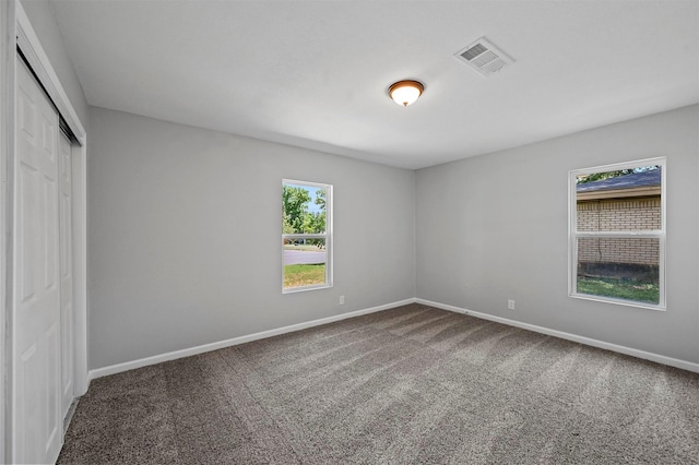 unfurnished room with carpet floors