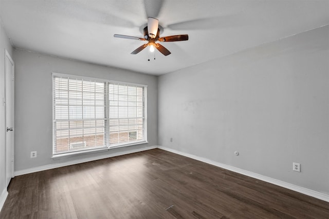 unfurnished room featuring dark hardwood / wood-style flooring and ceiling fan