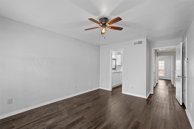 interior space with ceiling fan and dark wood-type flooring