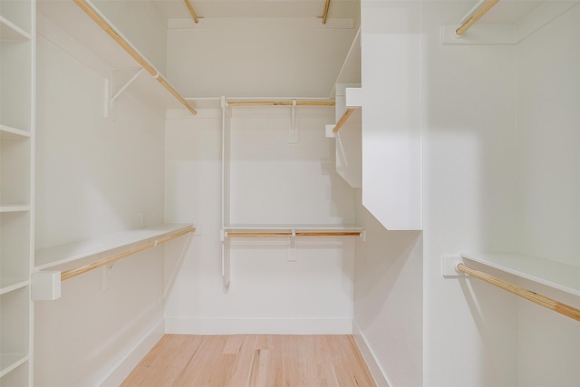 walk in closet featuring light hardwood / wood-style flooring