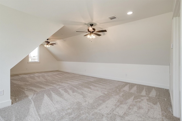 bonus room featuring lofted ceiling, ceiling fan, and light carpet