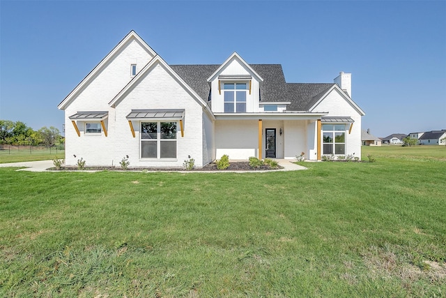 view of front of house with a front lawn