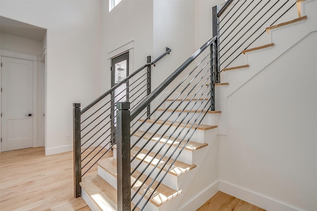 staircase featuring light hardwood / wood-style floors