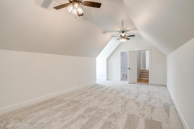 bonus room featuring ceiling fan, lofted ceiling, and light colored carpet